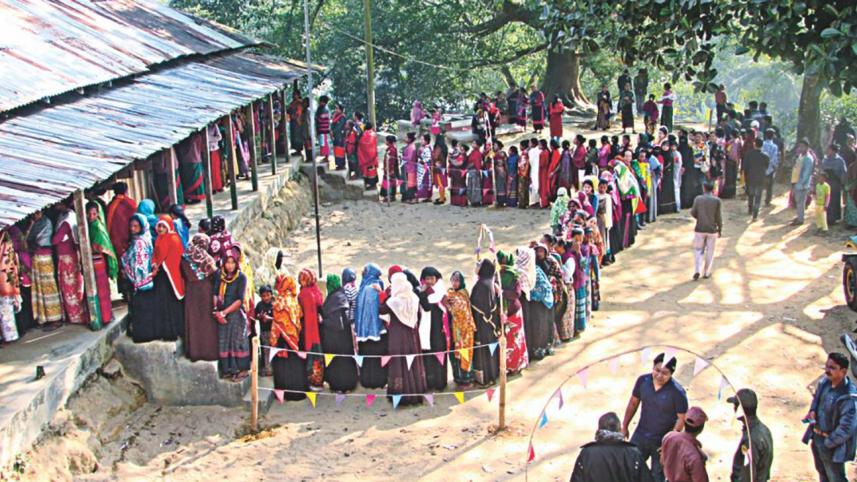 Female voters form a long queue