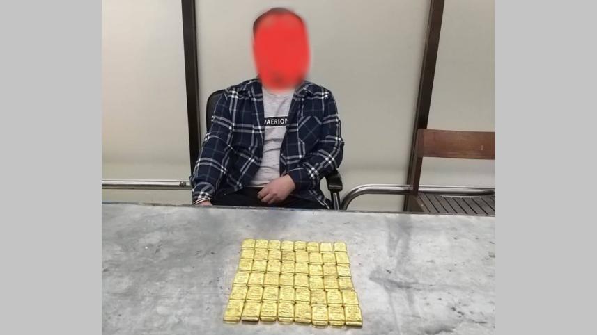 Customs officials detain a Chinese national on charge of smuggling in 48 gold bars at Dhaka airport