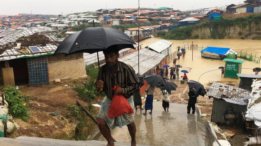 Rohingya refugees walks along the refugee camp