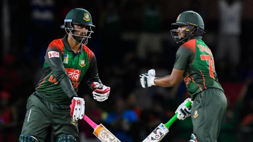 Tamim Iqbal and Shakib Al Hasan of Bangladesh speak during the 2nd T20i match 