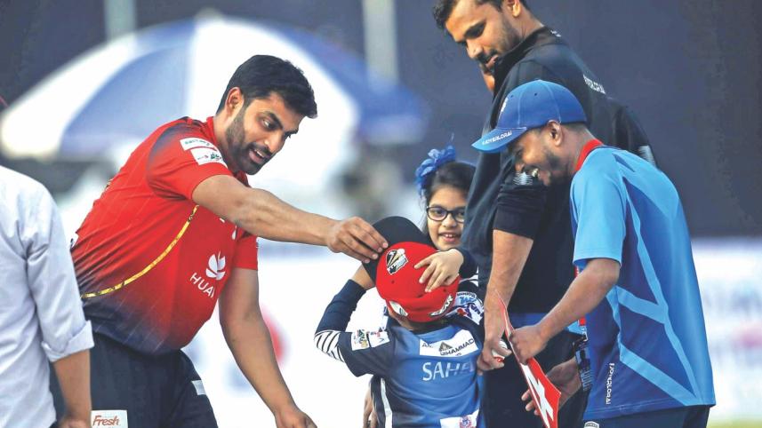 Comilla Victorians opener Tamim Iqbal gives his cap to Mashrafe Bin Mortaza's son