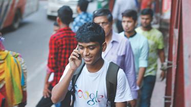 A man talks over his mobile.jpg