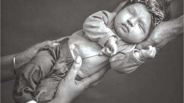 Cuddly newborns in front of the lens