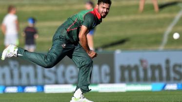 Bangladesh's paceman Mashrafe Mortaza bowls during the first ODI