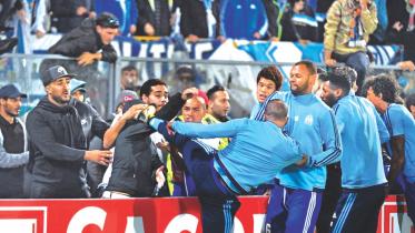 Patrice Evra kick supporter.jpg