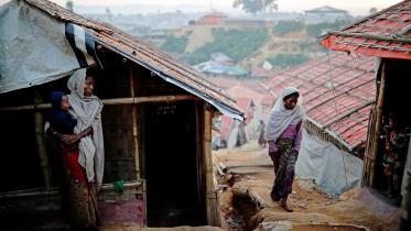 Rohingya refugee women go about their day at the Balukhali camp in Cox's Bazar