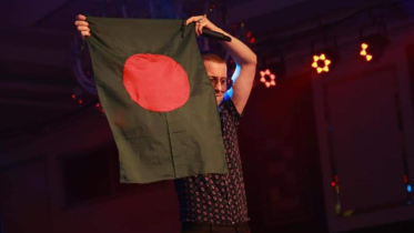 Akcent raises Bangladeshi flag.png