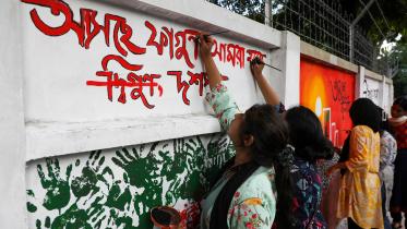 Students paint over vandalised walls