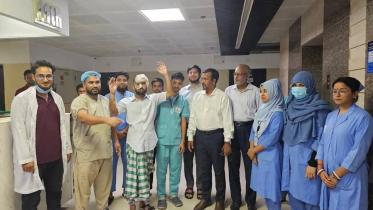 injured CU student walk for photo in hospital