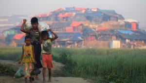 online_exclusive_rohingya_children_carry_sacks_of_donated_food_outside_of_a_rohingya_refugee_camp_in_bangladesh._photo_afp.jpg